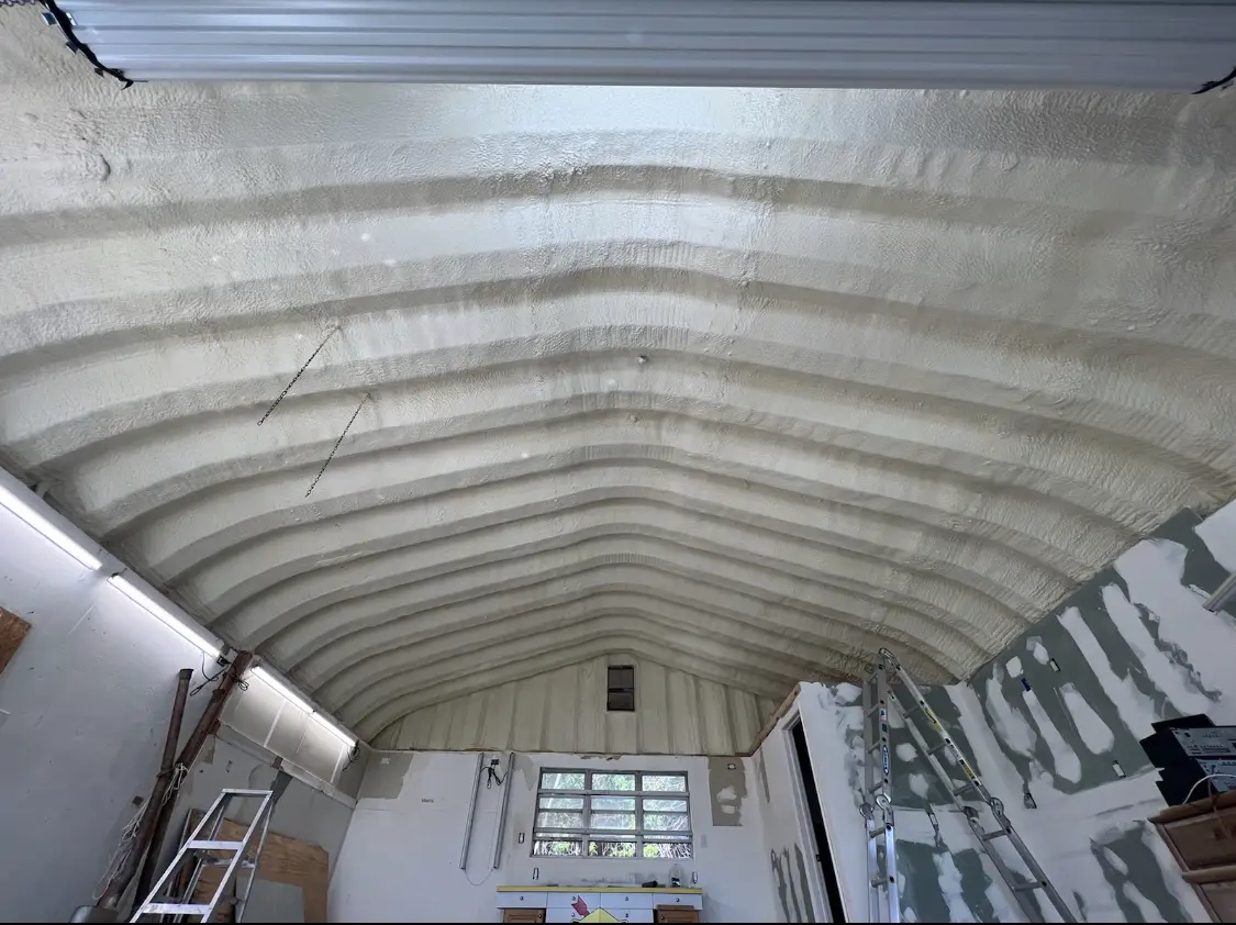 Spray polyurethane foam applied to the underside of a metal roof deck in Idabel